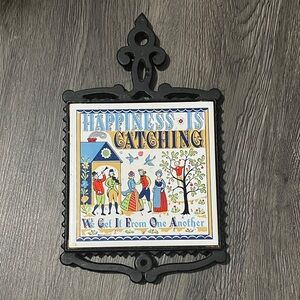 Vintage Iron trivet with Folk Art Design